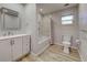 Modern bathroom with white cabinets and marble shower at 3187 Galiot Rd, Venice, FL 34293