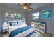 Bedroom with coastal decor and blue bedding at 3187 Galiot Rd, Venice, FL 34293