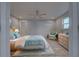 Bright bedroom with light blue bedding and wicker furniture at 3187 Galiot Rd, Venice, FL 34293