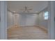 Spacious bedroom with light grey walls and wood-look flooring at 3187 Galiot Rd, Venice, FL 34293
