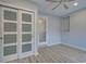Bedroom with modern closet doors and wood-look floors at 3187 Galiot Rd, Venice, FL 34293