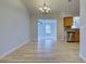 Bright dining room with hardwood floors and kitchen view at 3187 Galiot Rd, Venice, FL 34293
