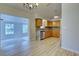 Modern kitchen with wood cabinets, granite counters and stainless steel appliances at 3187 Galiot Rd, Venice, FL 34293