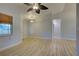 Bright living room with light flooring and ceiling fan at 3187 Galiot Rd, Venice, FL 34293