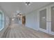 Spacious living area with wood-look floors and updated doors at 3187 Galiot Rd, Venice, FL 34293