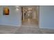 Open concept living area with light wood flooring and access to kitchen at 3187 Galiot Rd, Venice, FL 34293