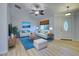Living room with comfy seating and blue rug at 3187 Galiot Rd, Venice, FL 34293