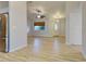 Spacious living room with light wood flooring, ceiling fan and window at 3187 Galiot Rd, Venice, FL 34293