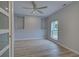 Home office with built-in shelving and wood-look floors at 3187 Galiot Rd, Venice, FL 34293