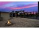 Firepit and waterfront view at sunset at 3300 Blue Jay Ln, Englewood, FL 34224