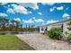 Landscaped backyard with gravel and water views at 3300 Blue Jay Ln, Englewood, FL 34224