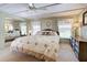 Spacious bedroom with king-size bed and mirrored closet doors at 3300 Blue Jay Ln, Englewood, FL 34224