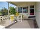 Covered patio with table and chairs, ideal for outdoor dining at 3300 Blue Jay Ln, Englewood, FL 34224