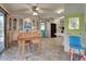 Cozy dining area with built-in hutch and wood table, view to kitchen at 3300 Blue Jay Ln, Englewood, FL 34224