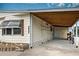 Carport with storage and bike at 3300 Blue Jay Ln, Englewood, FL 34224