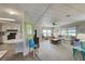 Open living room with kitchen and comfy seating at 3300 Blue Jay Ln, Englewood, FL 34224