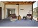 Relaxing screened porch with wicker chairs and water views at 3300 Blue Jay Ln, Englewood, FL 34224