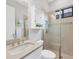 Small bathroom with a shower, toilet, and a white vanity with a quartz countertop at 400 Maraviya Blvd, Nokomis, FL 34275
