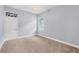 Spacious bedroom with light gray walls, carpet flooring, and a basketball hoop at 400 Maraviya Blvd, Nokomis, FL 34275