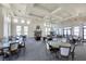 Spacious community room with stone fireplace and seating areas at 400 Maraviya Blvd, Nokomis, FL 34275
