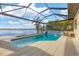 Relaxing pool with a water feature and stunning lake view at 400 Maraviya Blvd, Nokomis, FL 34275