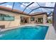 Inviting pool with covered patio and outdoor kitchen at 400 Maraviya Blvd, Nokomis, FL 34275