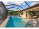 Relaxing pool and patio area with water feature at 400 Maraviya Blvd, Nokomis, FL 34275