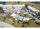 Aerial view of condo community, pool, and golf course at 408 Cerromar S Cir # 132, Venice, FL 34293