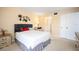 Bright bedroom with a queen bed and dresser at 408 Cerromar S Cir # 132, Venice, FL 34293