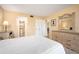 Bedroom with a queen bed and access to bathroom at 408 Cerromar S Cir # 132, Venice, FL 34293