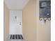Simple entryway with white door and small rug at 408 Cerromar S Cir # 132, Venice, FL 34293