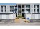 Condo building exterior with parking and walkway at 408 Cerromar S Cir # 132, Venice, FL 34293