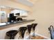 Kitchen features a breakfast bar with three stools at 408 Cerromar S Cir # 132, Venice, FL 34293