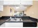 Kitchen with a breakfast bar overlooking living room at 408 Cerromar S Cir # 132, Venice, FL 34293