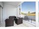 Screened patio with wicker furniture and golf course view at 408 Cerromar S Cir # 132, Venice, FL 34293