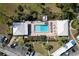 Community pool with surrounding lounge chairs at 408 Cerromar S Cir # 132, Venice, FL 34293