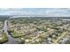 Aerial view showcasing a community of homes near a waterway at 4310 Albacore Cir, Port Charlotte, FL 33948