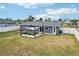 Backyard with patio and gray house at 4310 Albacore Cir, Port Charlotte, FL 33948