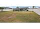 Large grassy backyard with home view at 4310 Albacore Cir, Port Charlotte, FL 33948