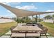 Relaxing backyard patio with shade sail and seating area at 4310 Albacore Cir, Port Charlotte, FL 33948