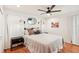 Cozy bedroom with a queen-size bed and hardwood floors at 4310 Albacore Cir, Port Charlotte, FL 33948