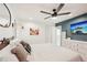 Main bedroom with a queen bed, large TV, and dresser at 4310 Albacore Cir, Port Charlotte, FL 33948