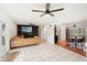 Gathering room with a large sectional sofa, TV, and tiled floors at 4310 Albacore Cir, Port Charlotte, FL 33948