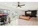 Gathering room with a large sectional sofa, TV, and access to backyard at 4310 Albacore Cir, Port Charlotte, FL 33948