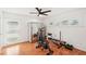Bright home gym with exercise bike, weights, and mirror at 4310 Albacore Cir, Port Charlotte, FL 33948