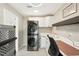 Modern laundry room with stacked washer and dryer at 4310 Albacore Cir, Port Charlotte, FL 33948