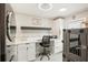 Laundry room with desk, washer, dryer and pet carrier at 4310 Albacore Cir, Port Charlotte, FL 33948