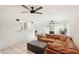 Living room features a brown leather sectional sofa and a modern barn door at 4310 Albacore Cir, Port Charlotte, FL 33948