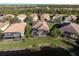Aerial view of homes near the lake at 438 Grand Preserve Cv, Bradenton, FL 34212