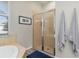 Bathroom with walk-in shower and tan tile at 438 Grand Preserve Cv, Bradenton, FL 34212